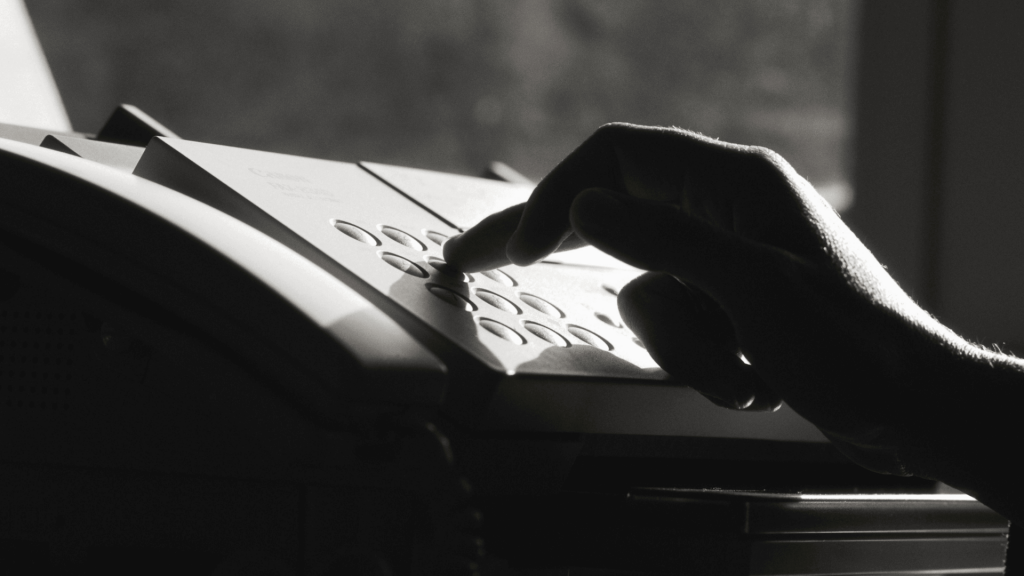 a fax machine pressed